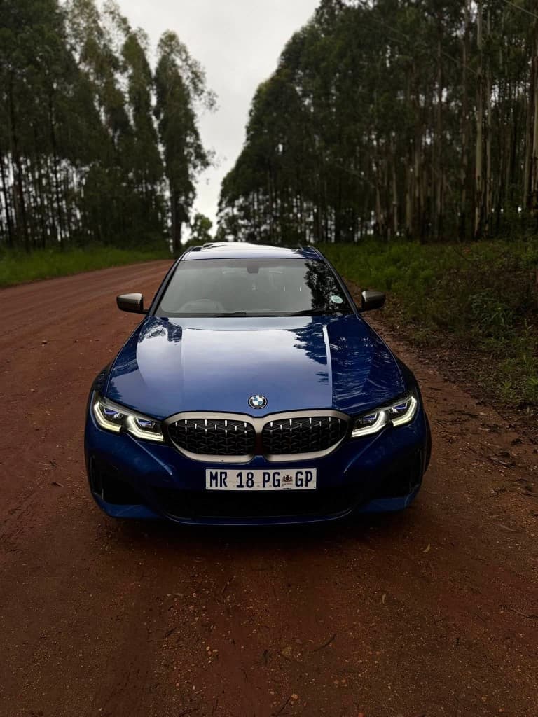 Blue BMW owner-driven arrival car